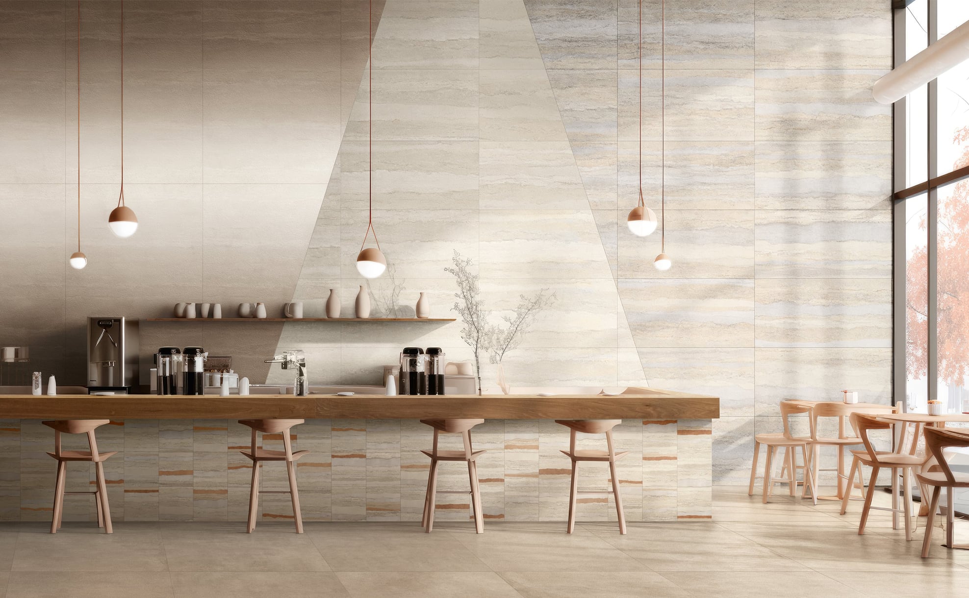 A modern café interior featuring a wooden counter, minimalist decor, and pendant lighting, with light-colored walls and seating.
